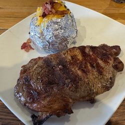 Ribeye with loaded baked potato