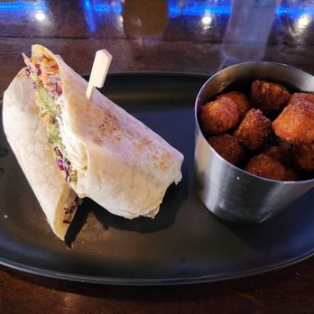 10 Twenty five - The New Hippie On The Block sandwich as a wrap with a side of Sweet Potato Tots - Gastropubs Near Me - Fort Myers, Florida 10 Twenty five - The New Hippie On The Block sandwich as a wrap with a side of Sweet Potato Tots - Gastropubs Near Me - Fort Myers, Florida