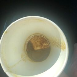 That's the bottom of the cup after dumping the drink. It's black and brown.