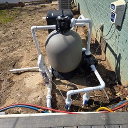 New pool pump and sand filter installed at opening.