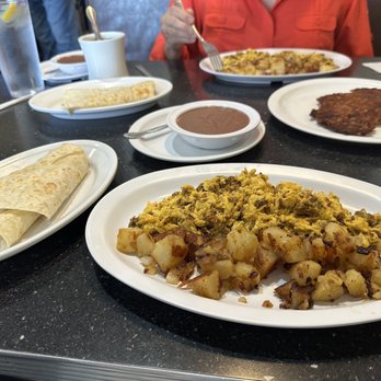 Joe's Cafe - Eggs with chorizo, side of beans, flour tortilla and side of corn beef hash. Delicious! - American Near Me - Sterling, Virginia Joe's Cafe - Eggs with chorizo, side of beans, flour tortilla and side of corn beef hash. Delicious! - American Near Me - Sterling, Virginia