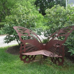 Harvest Moon Food Store - This lovely bench is outside by the bushes in front of the store.