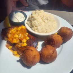 Catch of the Day - Blackened sword fish, cheesy grits, and hush puppies Catch of the Day - Blackened sword fish, cheesy grits, and hush puppies