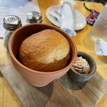 Terrain Cafe - Bread baked in Terra Cotta pot! Served with chocolate sea salt butter! - New American Near Me - Westport, Connecticut Terrain Cafe - Bread baked in Terra Cotta pot! Served with chocolate sea salt butter! - New American Near Me - Westport, Connecticut