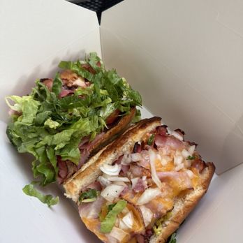 Scribles Bistro & Deli - Two remaining halves of our sandwiches: hubs removed the produce from his for reheating purposes.  Ham Grinder and Club - Delis Near Me - Eugene, Oregon