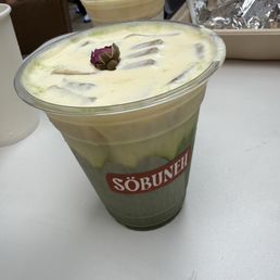 Sonnati matcha with rose and saffron cream top and pistachio milk
