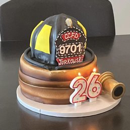 a cake with a fireman's helmet on top
