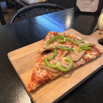Fatto A Mano - Slice of pizza with Italian sausage and green pepper - Italian Near Me - North Fort Myers, Florida Fatto A Mano - Slice of pizza with Italian sausage and green pepper - Italian Near Me - North Fort Myers, Florida