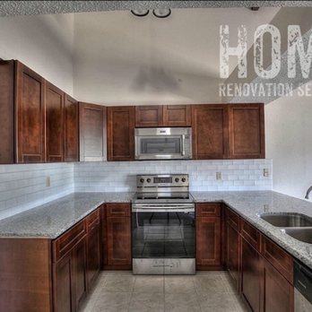 Home Renovation Services - a kitchen with stainless steel appliances - Flooring Near Me Home Renovation Services - a kitchen with stainless steel appliances - Flooring Near Me