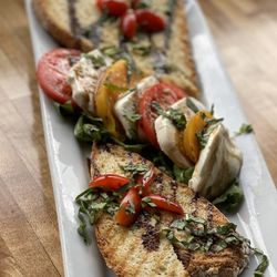 Hideaway House - CAPRESE PRIMITIVO Imported fresh mozzarella, vine ripened tomatoes, fresh basil, balsamic. Love the heart presentation.