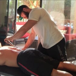 The Muscle Doc - Utilizing " Graston Technique", also known as instrument assisted soft tissue mobilization. One of many soft tissue therapies in the office