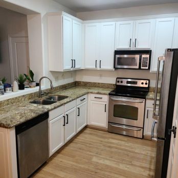 Bella Casa Painting - a kitchen with white cabinets and stainless steel appliances - Painters Near Me - Phoenix, Arizona Bella Casa Painting - a kitchen with white cabinets and stainless steel appliances - Painters Near Me - Phoenix, Arizona
