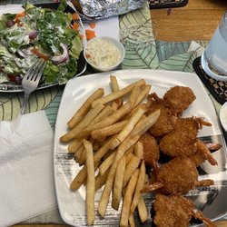 Jumbo fried shrimp, fries, and side salad.
