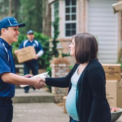 American Relocation Services - American Relocation Services employees moving household goods for a customer in Fairbanks, AK