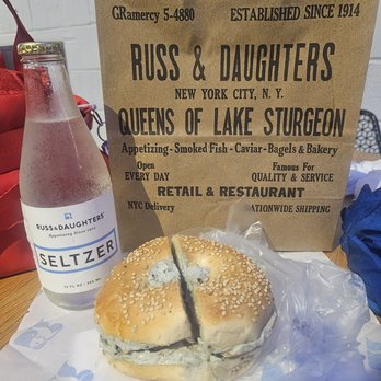 Russ & Daughters - Brooklyn - Sesame bagel with a caviar cream cheese schmear, onion & tomato. Branded seltzer. - Bagels Near Me - Brooklyn, New York Russ & Daughters - Brooklyn - Sesame bagel with a caviar cream cheese schmear, onion & tomato. Branded seltzer. - Bagels Near Me - Brooklyn, New York