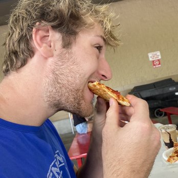 Costco Wholesale - Colin eating his pepperoni pizza. - Wholesale Stores Near Me - Altamonte Springs, Florida