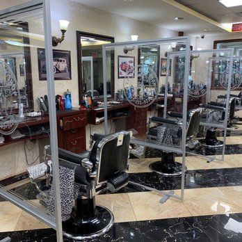 Ray's Barber Shop Tribeca - Screens between the chairs offer comfort to the patrons - Barbers Near Me - New York, New York Ray's Barber Shop Tribeca - Screens between the chairs offer comfort to the patrons - Barbers Near Me - New York, New York