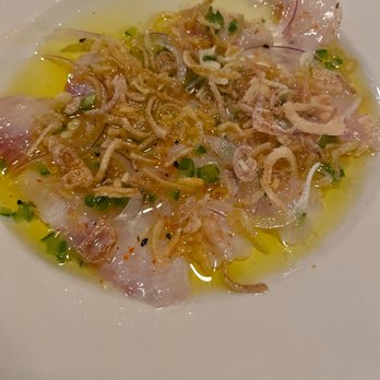 Stem Bar - a white plate of food on a table - Bars Near Me - Montreal, Quebec Stem Bar - a white plate of food on a table - Bars Near Me - Montreal, Quebec