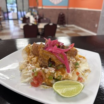 Finca Latina - a plate of food on a table - Tacos Near Me - Houston, Texas Finca Latina - a plate of food on a table - Tacos Near Me - Houston, Texas