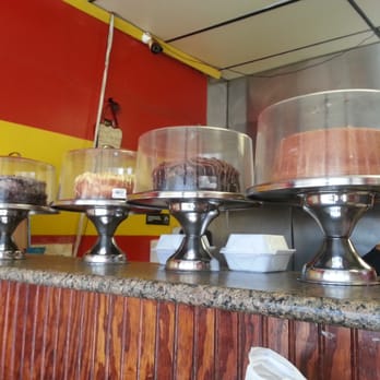 Express Wings - gorgeous layer cakes line the front counter, to be sold by the slice - Chicken Wings Near Me - Cincinnati, Ohio