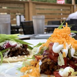 two tacos on a white plate
