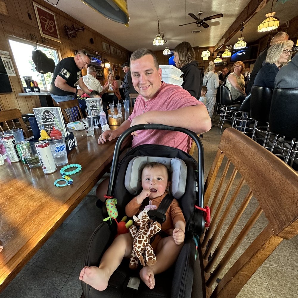 Halder Bridge Bar - a man and a baby in a stroller - Bars Near Me - Mosinee, Wisconsin Halder Bridge Bar - a man and a baby in a stroller - Bars Near Me - Mosinee, Wisconsin