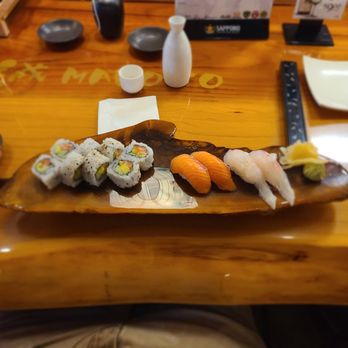 Makoto Japanese Restaurant - Beautiful wooden sushi board. In photo is a salmon roll and some salmon and sea breem nigiri. - Japanese Near Me - Eugene, Oregon Makoto Japanese Restaurant - Beautiful wooden sushi board. In photo is a salmon roll and some salmon and sea breem nigiri. - Japanese Near Me - Eugene, Oregon