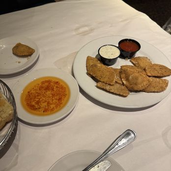 Bravo! Italian Kitchen - Seasoned olive oil for the focaccia bread, fried ravioli. - Italian Near Me - Louisville, Kentucky