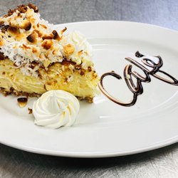 The Cafe on 26 - Homemade White Chocolate Cheesecake with a Toasted Coconut Crust
