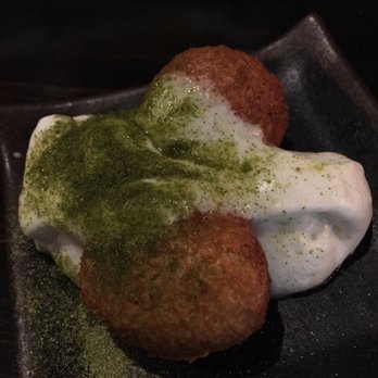 Maypop Restaurant - Amuse bouche- curry beinet with coconut matcha foam - New American Near Me - New Orleans, Louisiana