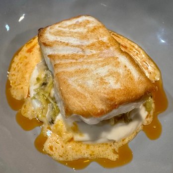 The Restorative - January Tasting Menu - Halibut with Celery Root and Braised Cabbage with Calabrian Chili Oil - New American Near Me - Dunedin, Florida The Restorative - January Tasting Menu - Halibut with Celery Root and Braised Cabbage with Calabrian Chili Oil - New American Near Me - Dunedin, Florida