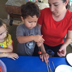 Making fruit skewers.