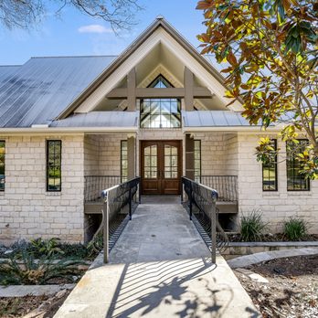 Pink Cube Development - Texas Hill Country home exterior remodel with limestone and metal roof - General Contractors Near Me Pink Cube Development - Texas Hill Country home exterior remodel with limestone and metal roof - General Contractors Near Me