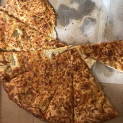 Pizza Milano - Burnt pizza and no extra cheese.