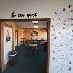 Java Spot - Visitor wall to sign and seating area