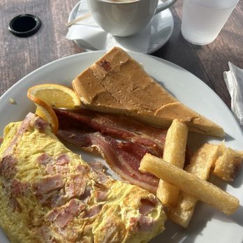 Sofrito Latin Cafe - Breakfast omelet with ham and Gouda cheese! Amazing! Enough to spilt with your spouse! - Latin American Near Me - Orlando, Florida Sofrito Latin Cafe - Breakfast omelet with ham and Gouda cheese! Amazing! Enough to spilt with your spouse! - Latin American Near Me - Orlando, Florida