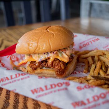 Waldos Chicken and Beer - a sandwich and french fries - Chicken Shop Near Me - Miramar Beach, Florida