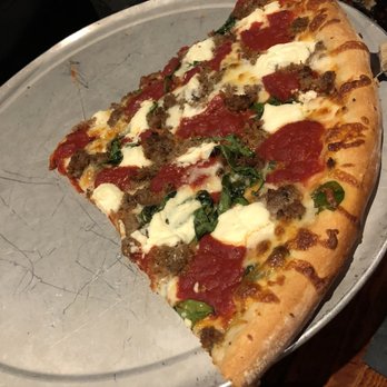 Rocco's - Not the best pic of the lasagna pizza. We were eating it too fast. But amazing! - Bars Near Me - Seattle, Washington