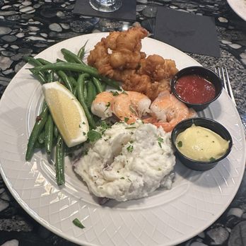 The Argonne House - 10 piece shrimp dinner with mashed potatoes, & green beans. Half fried/half steamed. 10/13/24 - American Near Me - Charlevoix, Michigan The Argonne House - 10 piece shrimp dinner with mashed potatoes, & green beans. Half fried/half steamed. 10/13/24 - American Near Me - Charlevoix, Michigan