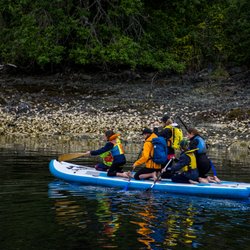Pacifica Paddle Sports - The Mega SUP is great for a picnic with a large group. The board can fit 6 adults and is perfect for a mid paddle swin.