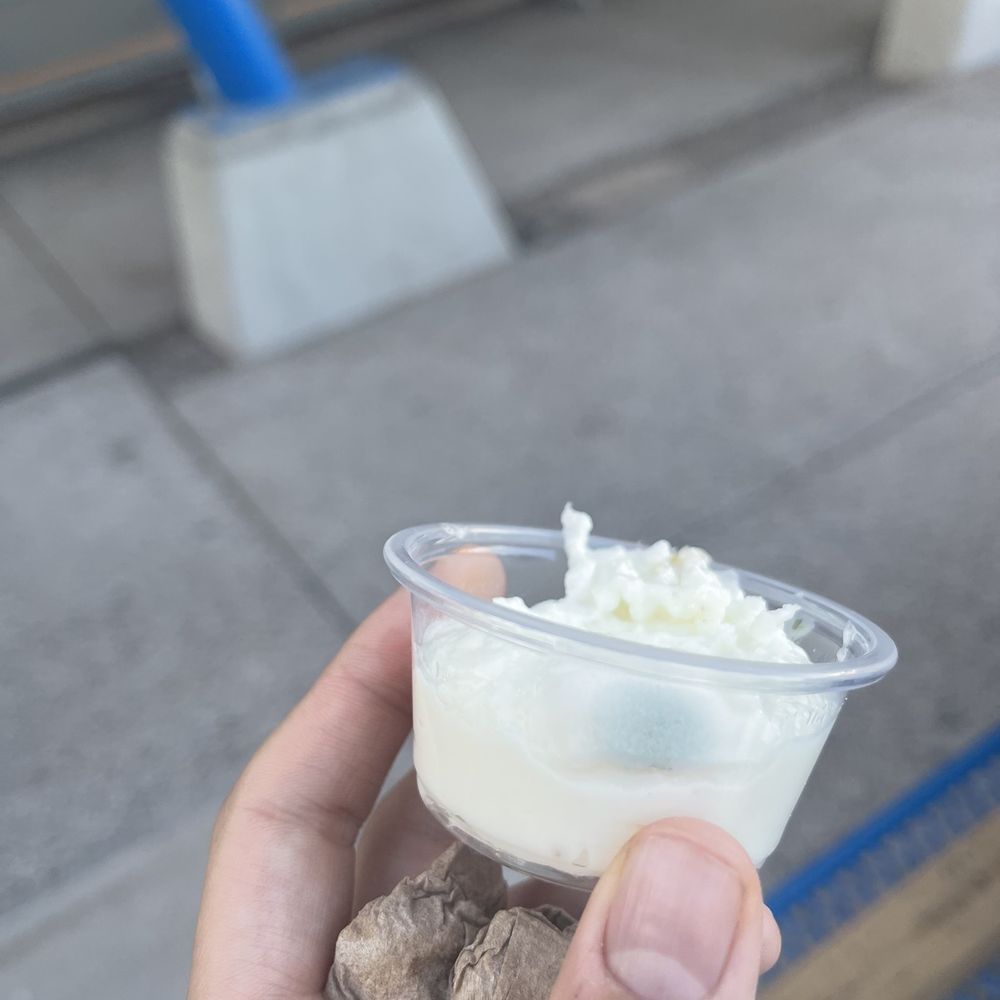 Pita Bistro - a hand holding a cup of ice cream - Mediterranean Near Me - Phoenix, Arizona Pita Bistro - a hand holding a cup of ice cream - Mediterranean Near Me - Phoenix, Arizona