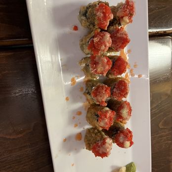 Kobe - a plate of food on a wooden table - Sushi Bars Near Me - Greece, New York