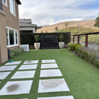 Norcal Concrete - a patio with grass and a fire hydrant - Masonry/Concrete Near Me Norcal Concrete - a patio with grass and a fire hydrant - Masonry/Concrete Near Me