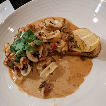 Matt's Red Rooster Grill - Fire roasted calamari, roasted tomato chipotle cream sauce served over roasted brushetta - New American Near Me - Flemington, New Jersey