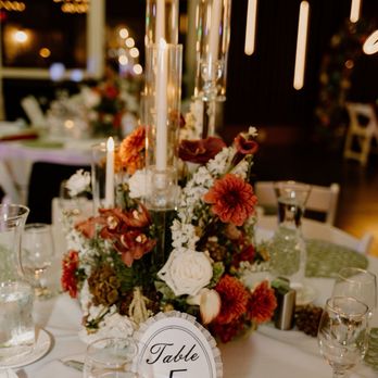 D'Lily's Flower - Floral table centerpiece with tall glass candles - Florists Near Me - Watsonville, California D'Lily's Flower - Floral table centerpiece with tall glass candles - Florists Near Me - Watsonville, California