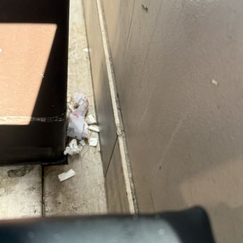 Pure Pho and Grill - Trash on the floor in booth area - Vietnamese Near Me - Cumming, Georgia