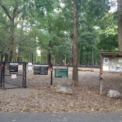 Friends of Paws Parks - Actual dog park entrance behind the shady trees.