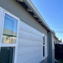 New white gutters and camouflaged gray downspouts New white gutters and camouflaged gray downspouts