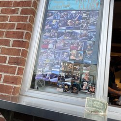 Starbucks - Pup wall with pictures of dogs that come through the drive through!