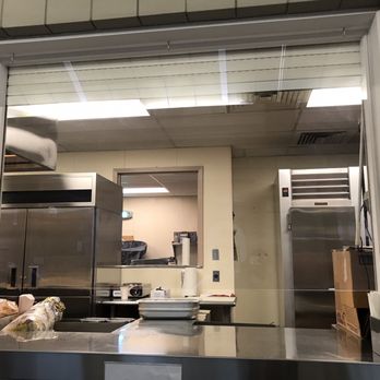 Rapid Ray's - a kitchen with stainless steel appliances - Burgers Near Me - Saco, Maine